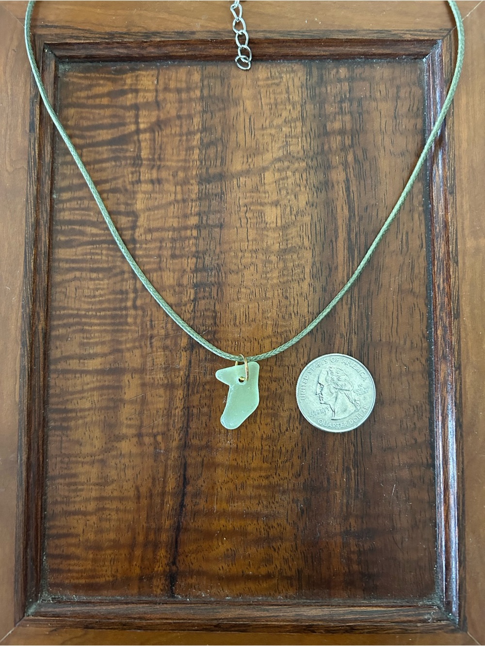 Unique shape light green sea glass pendant on 18-inch green cord